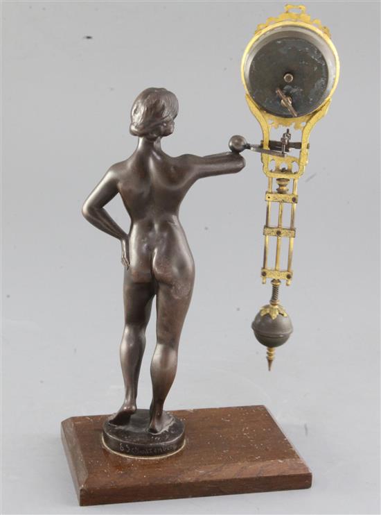 A late 19th century German bronze mystery timepiece, height 11.75in.